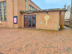 Paved outside area and doors to venue.