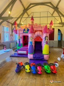 Pink castle themed bouncy castle