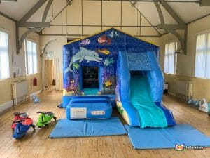 Bouncy castle with dolphins and fish.