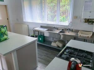 kitchen with stainless steel sinks and oven.
