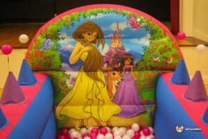 A colorful princess castle play area showcasing princesses and a ball pool, perfect for children's entertainment.