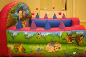 A whimsical princess castle with princess decorations and a ball pool, inviting children to engage in playful activities.