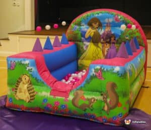 A princess castle play area with princess figures and a ball pool, designed for children's imaginative play.
