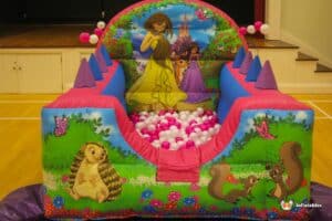 A vibrant ball pool where a princess and her friends are happily playing and enjoying their time.