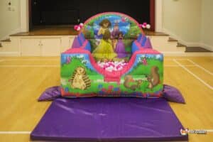 A colorful ball pool featuring a princess and her friends playing joyfully together.