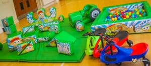 A large soft play area featuring colorful toys and a ball pit, designed for children to enjoy safe and fun playtime.