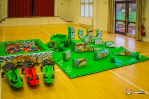 A colorful soft play area with engaging toys and a ball pit, offering a safe and enjoyable play experience for children.