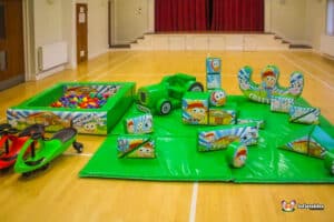 A large soft play area with bright toys and a ball pit, designed for children to enjoy a safe and fun playtime experience.
