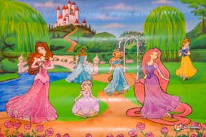 A large inflatable castle featuring colorful princesses and various characters, set up for children's play and entertainment.