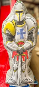A decorative castleshowcasing a knight and sword, ideal for adding a medieval touch to any space.