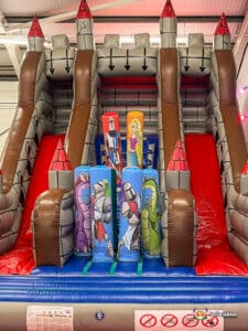 A whimsical castle slide, perfect for kids to climb and enjoy sliding adventures.