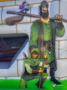 A whimsical illustration of two characters: a knight on a branch and a crouching archer, set against a castle-like backdrop.