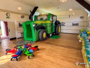 Ullenhall Village Hall Farm Tractor bouncy castle with plasma cars