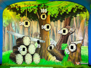 A straight-on view of the forest-themed target banner, showing squirrels and various circular point-value targets.