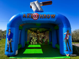 Frontal view of the Axe Throwing Arena unit, highlighting the peaked entrance and the colorful forest-themed target mural at the back of the inflatable tunnel.