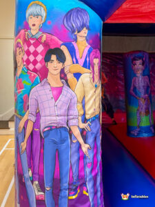 Detailed artwork on a pillar showing a group of stylish anime-style male characters.