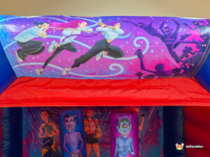 Mural on the top of the bouncer depicting anime-style female warriors fighting purple shadowy figures.
